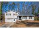 Two-story house with gray roof and white siding, featuring a spacious yard at 600 Green Mountain Trl, College Park, GA 30349