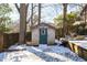 Charming backyard shed with wood siding and blue door at 1797 Hosea L Williams Se Dr, Atlanta, GA 30317