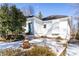 White house exterior with teal door and snowy landscaping at 1797 Hosea L Williams Se Dr, Atlanta, GA 30317