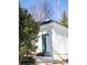 White house exterior with teal door and snowy landscaping at 1797 Hosea L Williams Se Dr, Atlanta, GA 30317