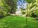 Large backyard with lush lawn and mature trees at 1841 Bayberry Dr, Atlanta, GA 30311