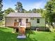 Charming home with a deck and stairs leading to a grassy backyard at 1841 Bayberry Dr, Atlanta, GA 30311