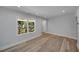 Bright and airy basement with vinyl plank flooring and large window at 1841 Bayberry Dr, Atlanta, GA 30311