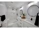 Modern bathroom with double vanity, large shower, and marble tile at 1841 Bayberry Dr, Atlanta, GA 30311