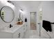 Elegant bathroom with dual sinks, and marble flooring at 1841 Bayberry Dr, Atlanta, GA 30311