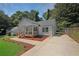 Newly renovated home with front porch and landscaping at 1841 Bayberry Dr, Atlanta, GA 30311