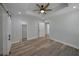 Main bedroom with high ceiling, wood flooring, and multiple closets at 1841 Bayberry Dr, Atlanta, GA 30311