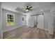 Main bedroom with vaulted ceiling, barn door, and ceiling fan at 1841 Bayberry Dr, Atlanta, GA 30311