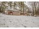 Snowy backyard with a view of the home's back elevation at 29 Oak Sw Dr, Atlanta, GA 30354