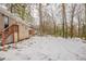 Large backyard with snow covered ground and mature trees at 29 Oak Sw Dr, Atlanta, GA 30354