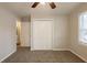 Well-lit bedroom with double door closet and access to hallway at 29 Oak Sw Dr, Atlanta, GA 30354