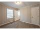 Spacious bedroom with wood paneling and exterior access at 29 Oak Sw Dr, Atlanta, GA 30354