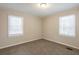 Charming bedroom with neutral walls and two windows at 29 Oak Sw Dr, Atlanta, GA 30354