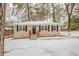 Ranch style home with snow covered yard at 29 Oak Sw Dr, Atlanta, GA 30354