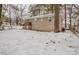 Side view of a Ranch home with a snow covered yard at 29 Oak Sw Dr, Atlanta, GA 30354