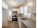 Updated kitchen with stainless steel appliances and granite counters at 29 Oak Sw Dr, Atlanta, GA 30354