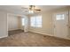 Living room with hardwood floors, ceiling fan and access to other rooms at 29 Oak Sw Dr, Atlanta, GA 30354