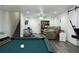 Finished basement with a pool table and ample living space at 399 Towler Dr, Loganville, GA 30052