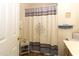 Small bathroom with shower and decorative items at 399 Towler Dr, Loganville, GA 30052