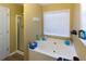 Relaxing bathroom with a garden tub and separate shower at 399 Towler Dr, Loganville, GA 30052