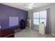 Purple bedroom with a bench and window with natural light at 399 Towler Dr, Loganville, GA 30052