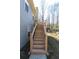 Stairs leading up to a deck overlooking the backyard at 399 Towler Dr, Loganville, GA 30052