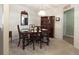 Formal dining room with a wood table and hutch at 399 Towler Dr, Loganville, GA 30052