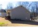 Gray house exterior with gray roof and AC unit at 399 Towler Dr, Loganville, GA 30052