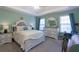 Main bedroom with a large bed, dresser, and soft green walls at 399 Towler Dr, Loganville, GA 30052