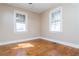 Spacious bedroom with hardwood floors and two windows at 4471 Gibson Pl, Acworth, GA 30101