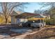 Carport with storage shed and two cars at 4471 Gibson Pl, Acworth, GA 30101