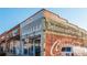 Historic brick buildings with unique storefronts and signage at 4471 Gibson Pl, Acworth, GA 30101