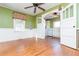 Open dining room with hardwood floors and a view into the kitchen at 4471 Gibson Pl, Acworth, GA 30101