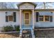 Inviting front door entrance with a yellow door and stone steps at 4471 Gibson Pl, Acworth, GA 30101