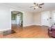 Bright living room featuring hardwood floors, a ceiling fan, and a view to other rooms at 4471 Gibson Pl, Acworth, GA 30101