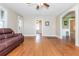 Hardwood floor living room with a ceiling fan and view into adjacent rooms at 4471 Gibson Pl, Acworth, GA 30101