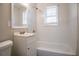Clean bathroom featuring a tub, sink, and vanity at 454 Oak Se Dr, Atlanta, GA 30354
