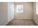 Bright bedroom featuring neutral walls, carpet, and a closet at 454 Oak Se Dr, Atlanta, GA 30354