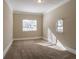 Well-lit bedroom with neutral walls and carpeted floors at 454 Oak Se Dr, Atlanta, GA 30354