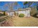 Gray ranch home with red door and mature trees at 454 Oak Se Dr, Atlanta, GA 30354