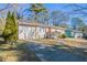 Front view of a charming ranch home with a concrete driveway at 454 Oak Se Dr, Atlanta, GA 30354
