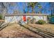 Ranch style home with red front door, gray exterior, and small yard at 454 Oak Se Dr, Atlanta, GA 30354