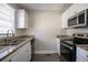 Modern kitchen featuring granite countertops and stainless steel appliances at 454 Oak Se Dr, Atlanta, GA 30354