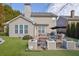 Backyard with patio, artificial turf and grill at 104 Johnston Farm Ln, Woodstock, GA 30188
