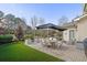 Backyard patio with seating area and umbrella at 104 Johnston Farm Ln, Woodstock, GA 30188