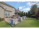 Large backyard with patio, artificial turf, and grill at 104 Johnston Farm Ln, Woodstock, GA 30188