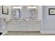 Double vanity bathroom with updated cabinets and mirrors at 104 Johnston Farm Ln, Woodstock, GA 30188