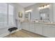 Double vanity bathroom with updated cabinets and mirrors at 104 Johnston Farm Ln, Woodstock, GA 30188