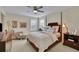 Spacious bedroom with wood bed frame and ample closet space at 104 Johnston Farm Ln, Woodstock, GA 30188