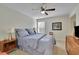 Bedroom with ceiling fan and dresser at 104 Johnston Farm Ln, Woodstock, GA 30188